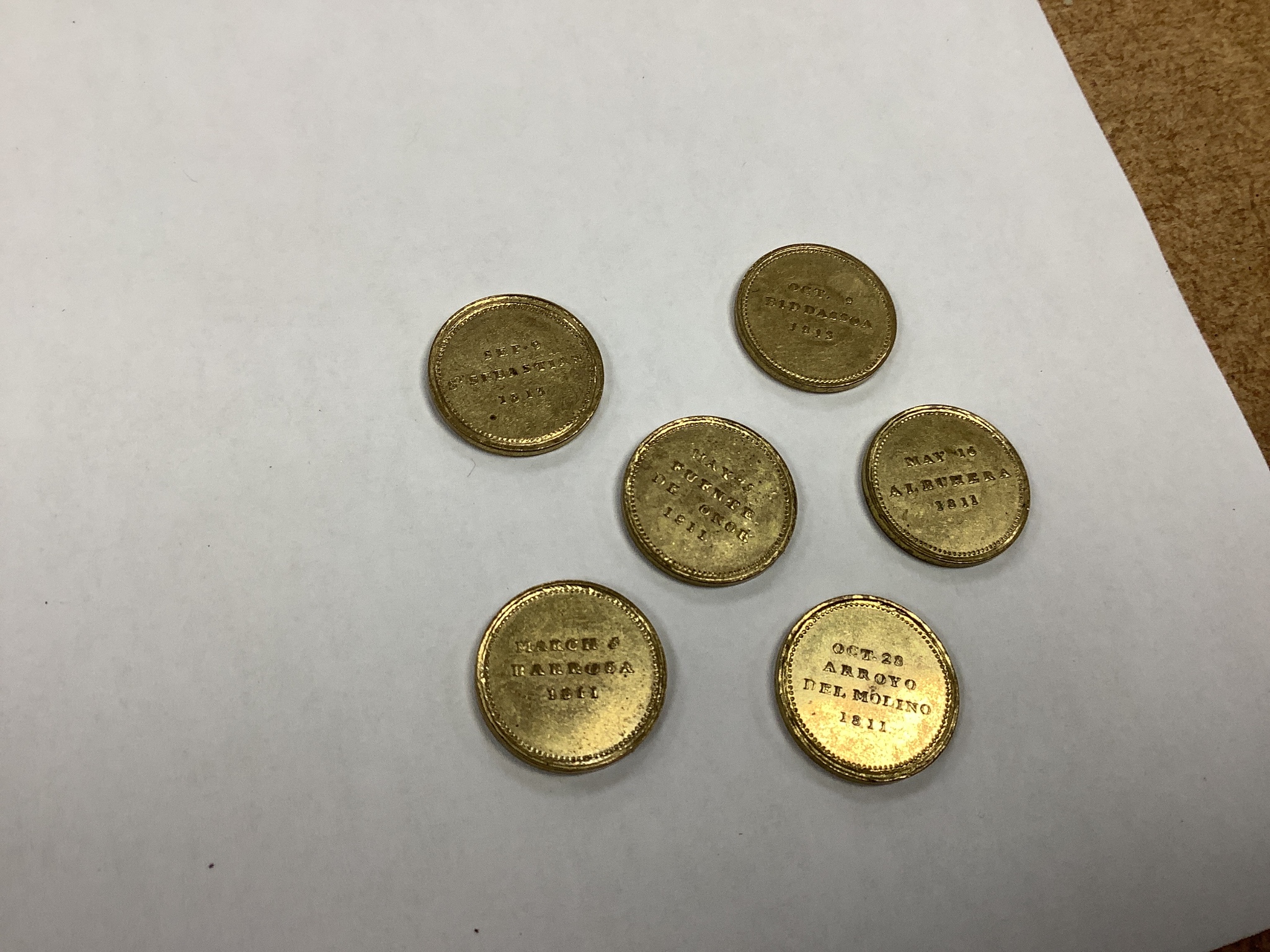 Marquis of Wellington’ British Victories in the Peninsular Campaign cylindrical brass box by Thomason & Jones, containing 23 gilt medallions, together with a cased silver commemorative medallion